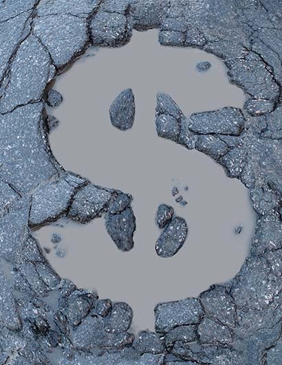 A dollar-sign-shaped pothole